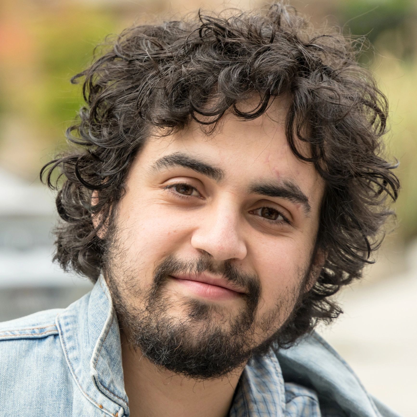 Portrait of a smiling person in natural light