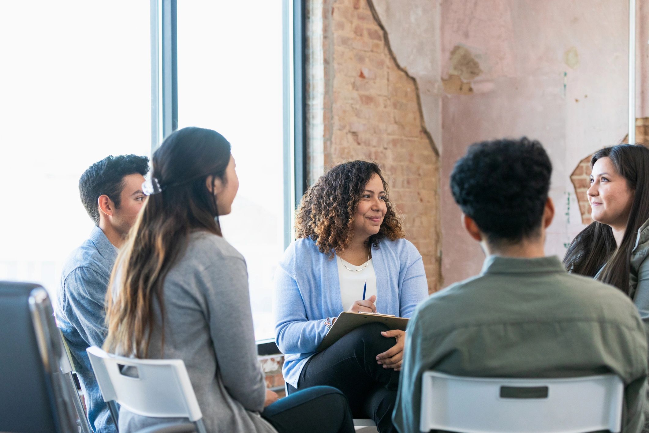 Therapy group listening attentively during a sharing circle