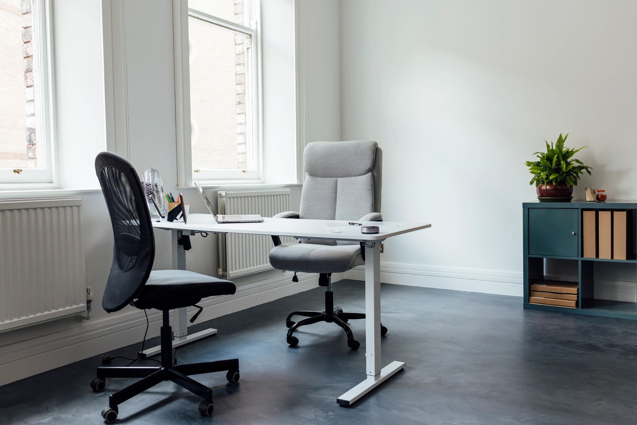 Calm, neutral room with chair and plant, representing a safe space