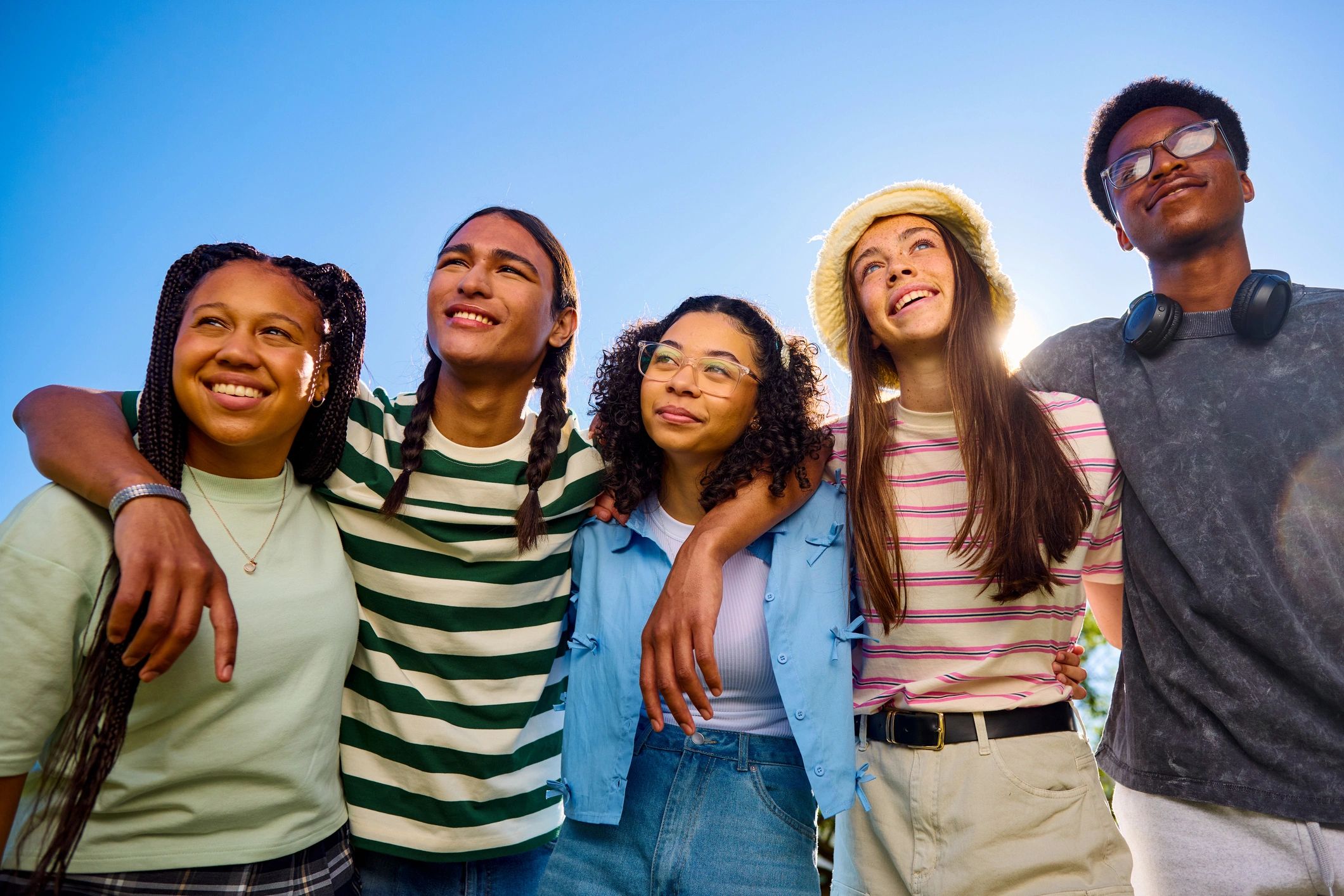 Friends embracing outdoors, symbolizing connection and belonging