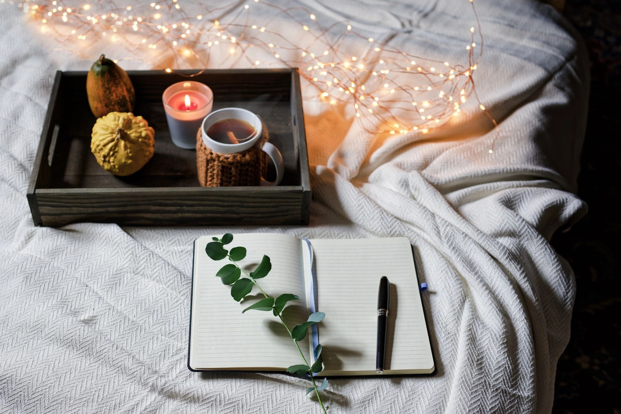 Cozy journaling setup with tea and a notebook for reflection
