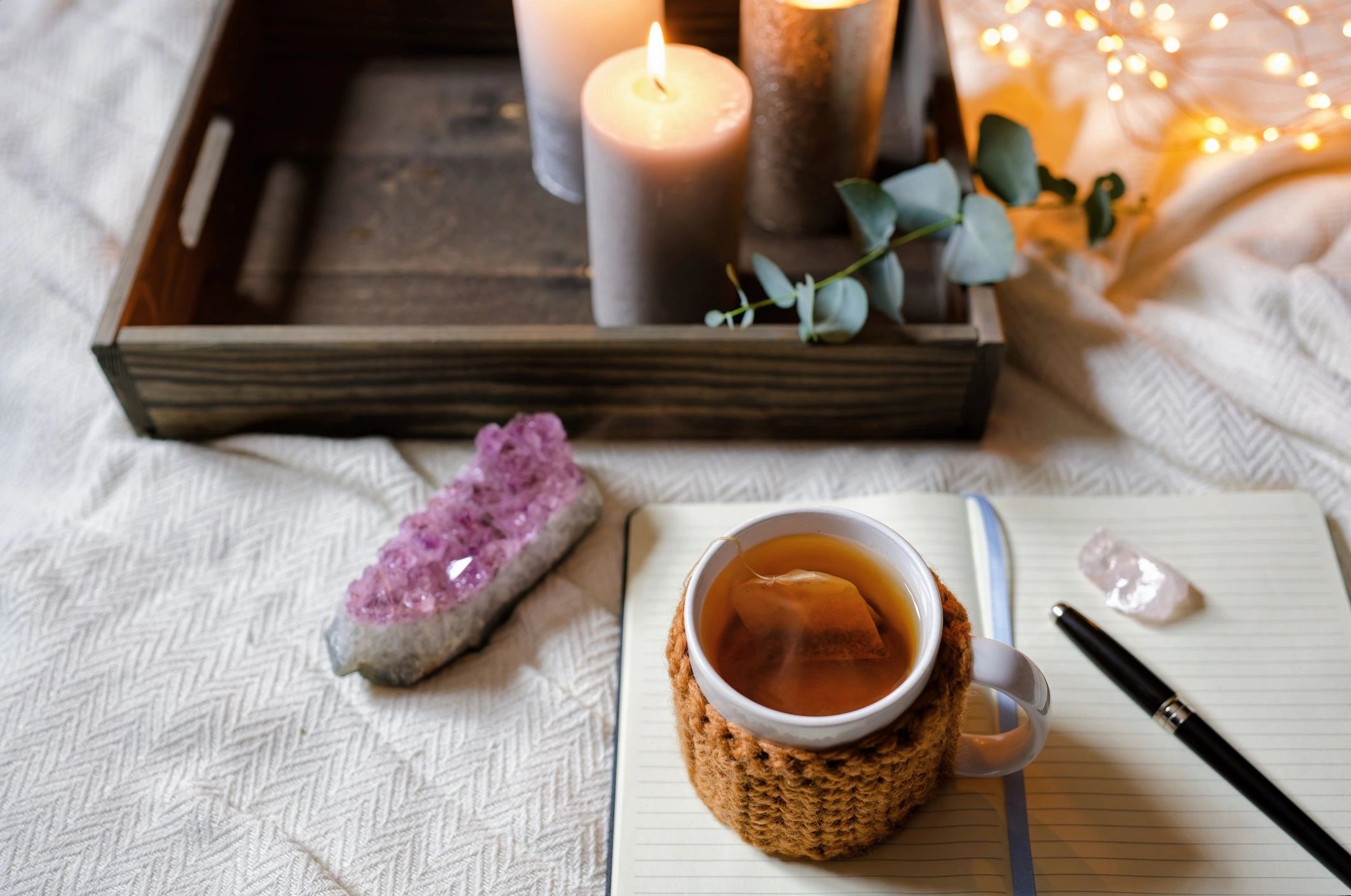 Relaxing journaling setup with tea and a notebook